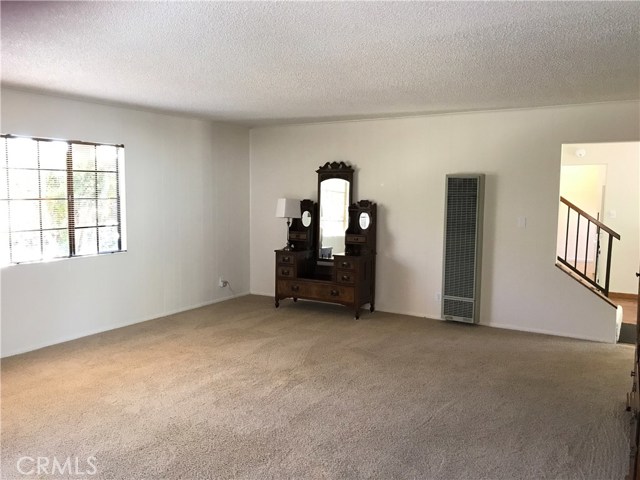 Family room looking back at dining room and stairs