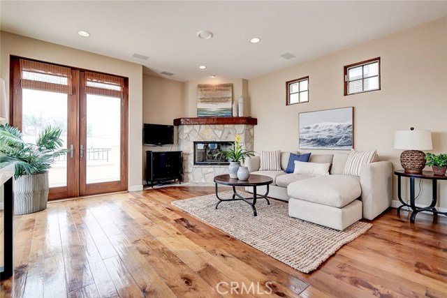 Spacious great room adjacent to the kitchen with it's own fireplace - perfect for those sunset cocktails!