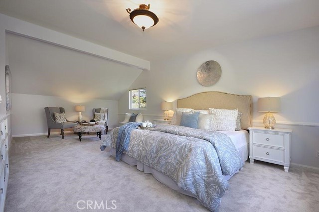 Upstairs Master Bedroom with Vaulted Ceiling, Sitting area and Views of Back Yard below.