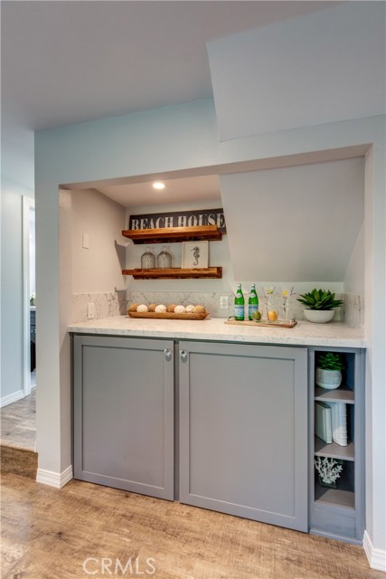 Laundry cabinets with counter top that can be used as a folding station or bar area
