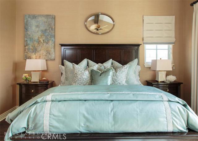 Master bedroom, luxuriously appointed by Barclay Butera, including fine linens and furniture.