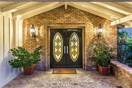 Lovely custom brickwork, double door entry, warmly welcoming guests.