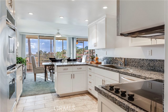 Plenty of light and cupboard space in airy kitchen with a view.