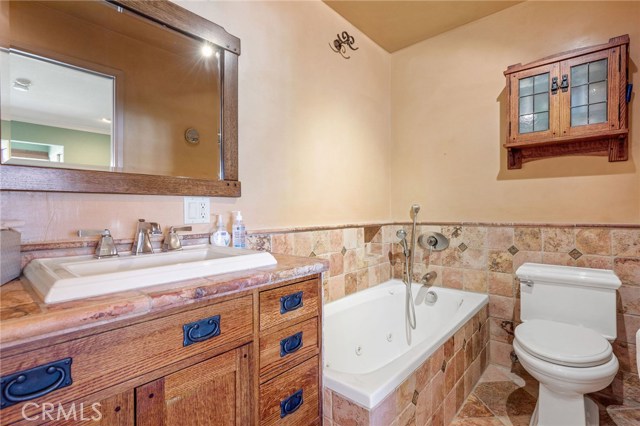 I call this the "grotto" bathroom. Custom tile, custom vanity, separate tub (blowers only, no heater), separate shower.