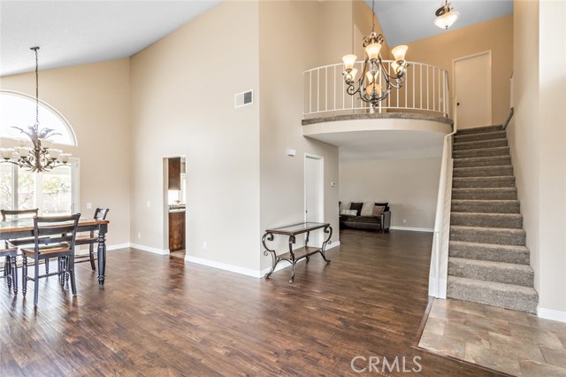 Dining room to the left with staircase to the second level to the right