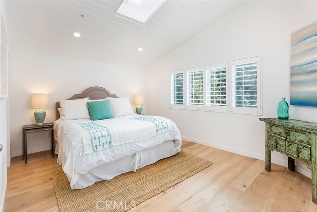MASTER BEDROOM WITH SKYLIGHT, RECESSED LIGHTING, PRIVATE BALCONY OVER LOOKING BACKYARD, HIS AND HERS WALK IN CLOSET WITH CUSTOM CABINETRY, PRIVATE MASTER BATH FULL OF MARBLE AND BENCH