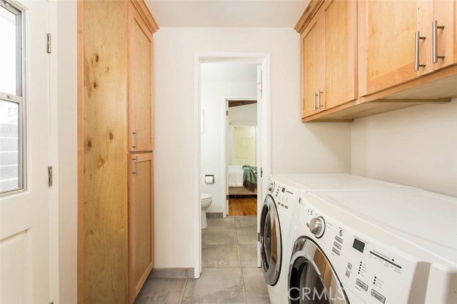 Laundry room and 3/4 bath into master bedroom.  Tankless water heater inside tall cabinet.