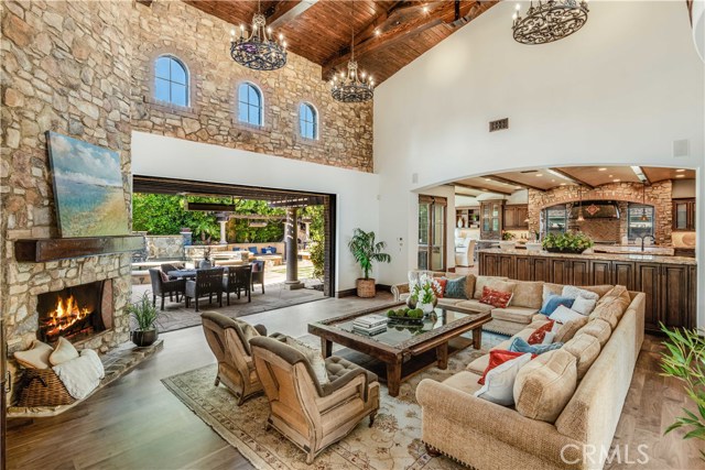 Massive family room with two story ceilings and custom wood and beamed ceilings