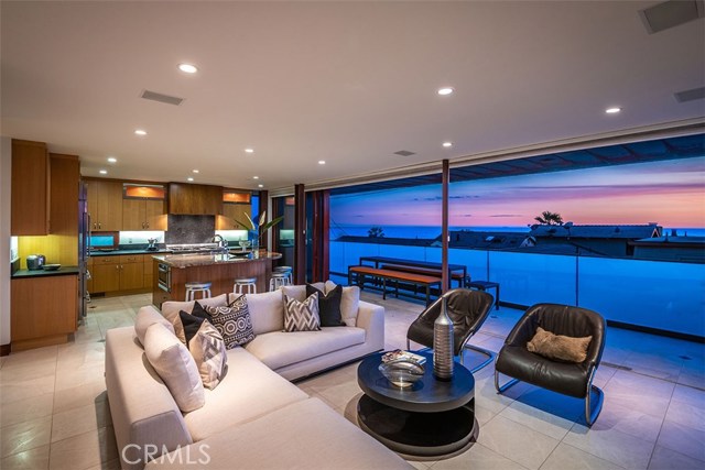 Family room, kitchen and ocean view patio