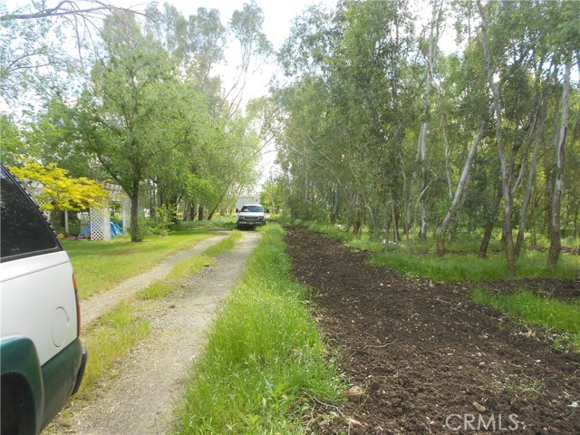 property line is close to driveway. Go to left is subjects