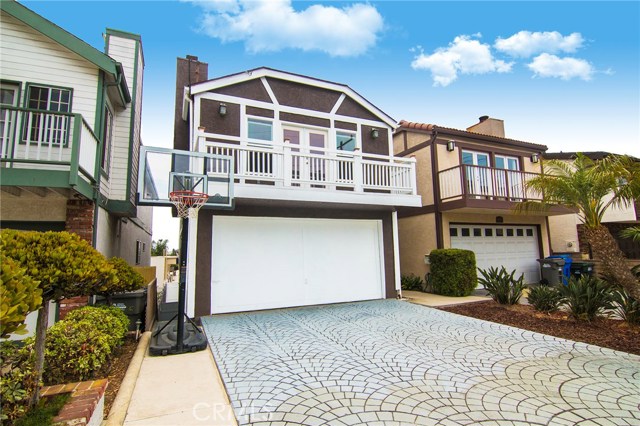 Paved driveway and view of family room balcony