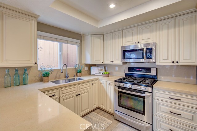 High quality CAESARSTONE countertops, wooden soft closing cabinets, oversized sink, carbon water filters & porcelain floors