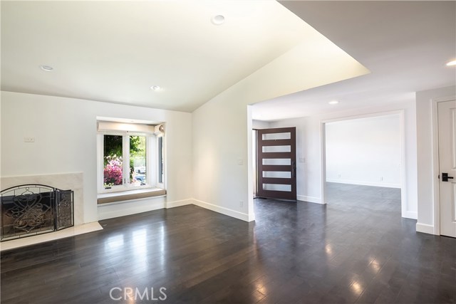 Living room looking into foyer and family room