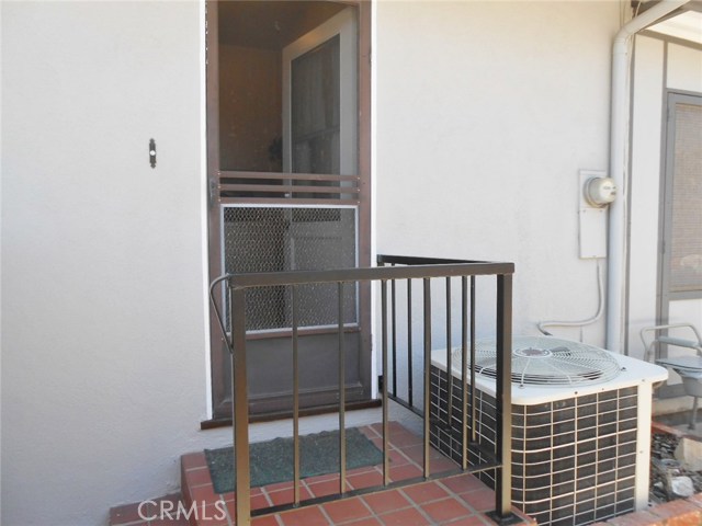 Exterior View of Side Utility Entrance and Screen Door. How About a That Door Bell?
