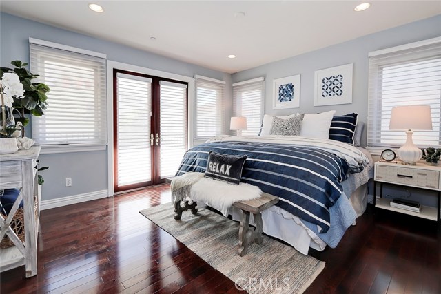 Peaceful master bedroom retreat with french door access to private balcony and large walk-in closet.