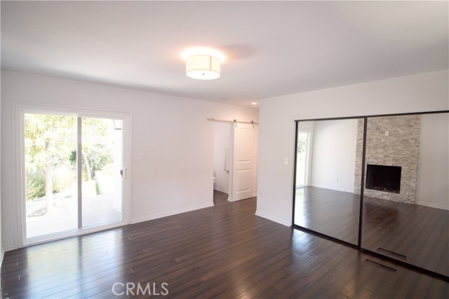 Master Bedroom ensuite with private bath & cozy fireplace. New Floating Engineered wood flooring throughout, new dual glazed fiberglass windows, new interior solid core doors throughout, fresh paint inside and out.