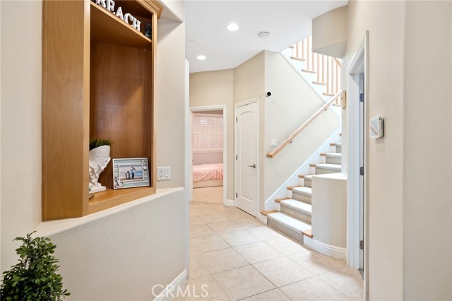 Entrance foyer with 2 bedrooms, storage closet, entrance to garage