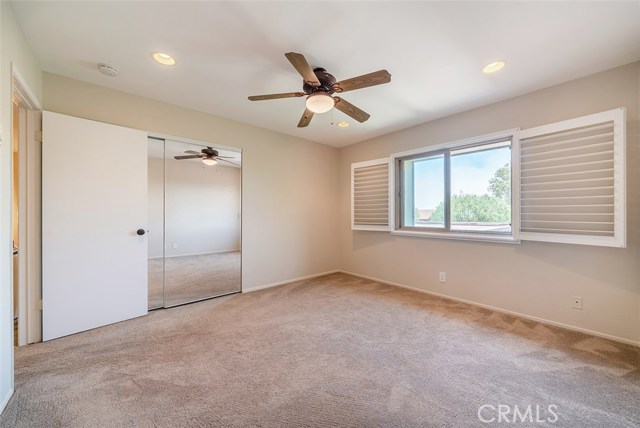 Another spacious upstairs bedroom also with peek a boo ocean view