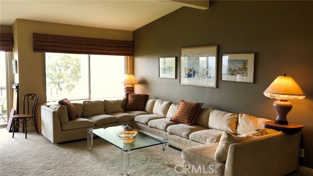 Spacious living room with cathedral ceilings and spectacular views.