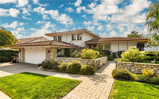 Paver driveway and walkway.  Charming PV stone garden wall and wrought iron gate.  Beautiful Rose Garden.