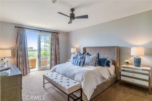 Spacious master bedroom with French doors to patio overlooking golf course.