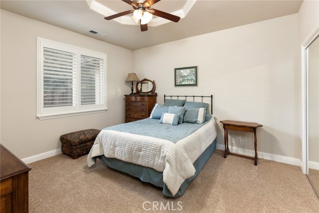 Bedroom with ceiling fan.