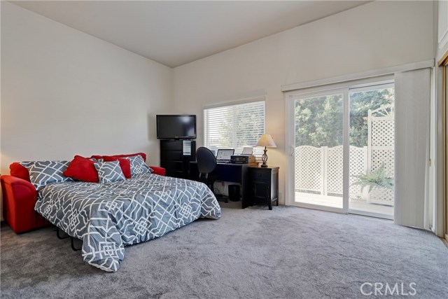 Bedroom #2, with private balcony over looking the back yard and great closet space.