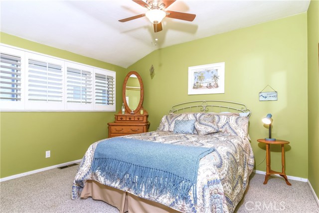 The second bedroom has coffered ceilings and a large full wall closet