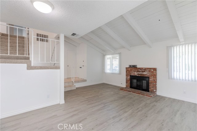 Cozy up around the brick fireplace