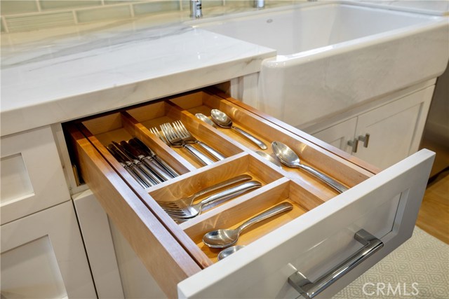 Conveniences to be discovered with the two-level utensil drawer.