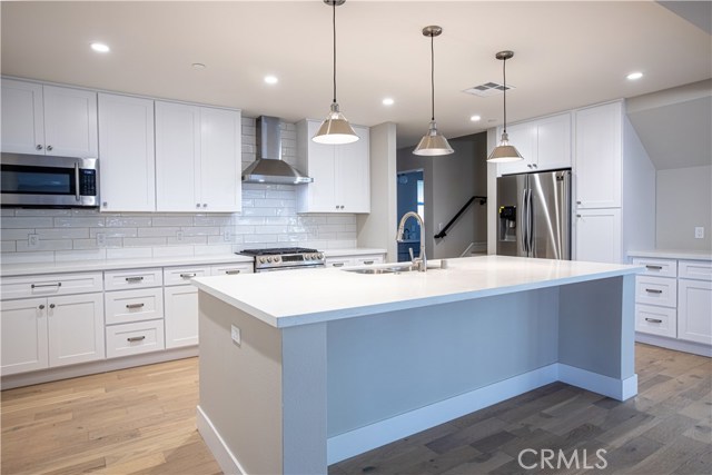 This Home has White Kitchen Option - 24240 (The Staged Model) pictured in videos has dark cabinets
