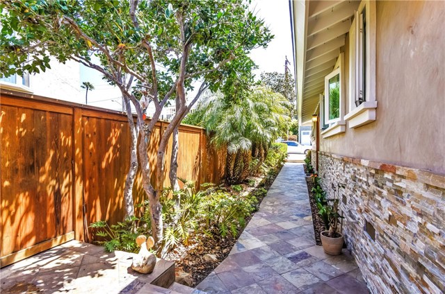 The lush landscaping along the entry creates a private and welcoming feel for friends and guests.