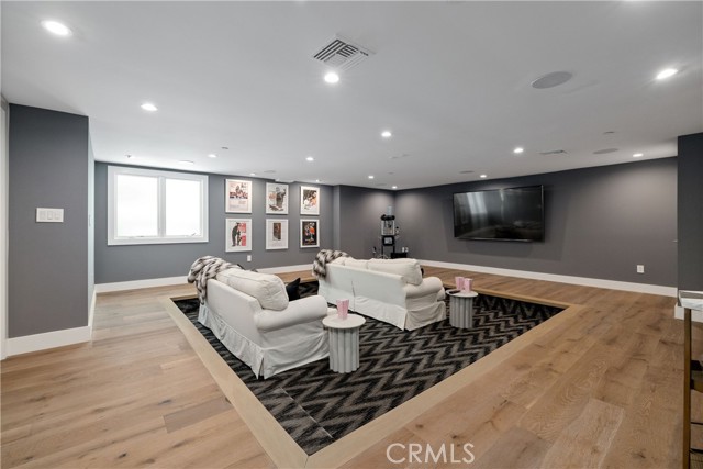 Fully equipped in-home movie theatre/media room with sunken living room feature.