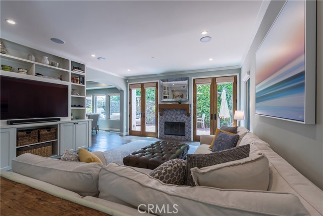 Super welcoming upon entry, with double French doors leading out to the gorgeous rear yard!  Beautiful builtins were added by the owner.