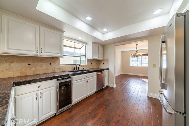 Nice large kitchen with granite countertops, stainless steel appliances, wine fridge and more!