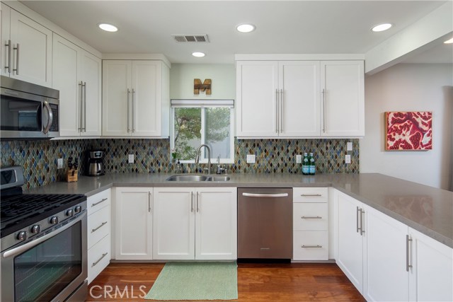 Caesarstone counter tops. Glass tile blacksplash. Soft closing drawers.