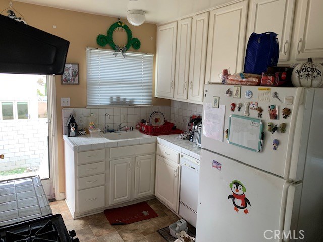 Upstairs Unit Kitchen and back entry.