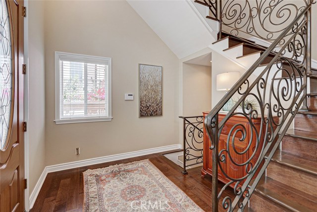 Wood floors and iron railings at entry