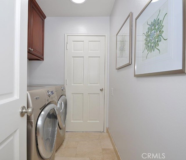 Laundry room with door to garage.