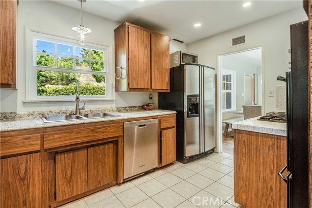 Kitchen opens up to dining room and features plenty of storage space