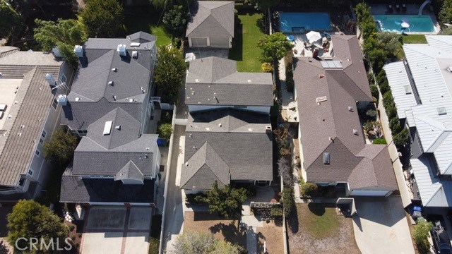Detached oversized 2 car garage (28' deep and 23'wide) with ideal area for office. Long gated driveway and nice grass lawn.