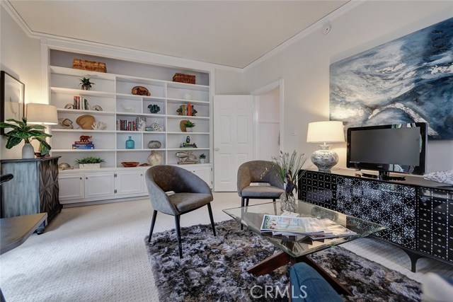 Beautiful custom crown molding and floor to ceiling built-ins.