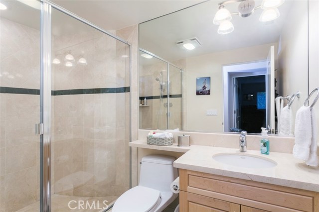 3/4 lower level bath with oversized shower just off bedroom