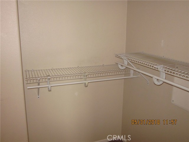 Note upgraded shelving in master closet