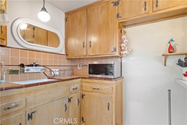 Family room kitchenette with original tile!
