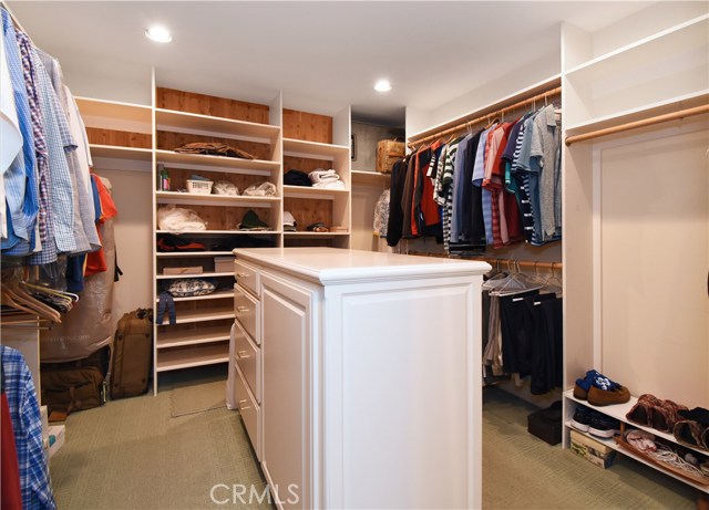 Master suite's walk in closet with built in dresser, cedar wall.