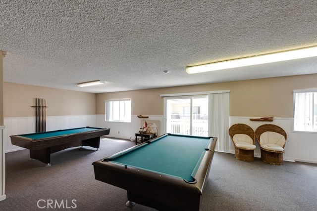 Game room w/ pool tables, ping pong table and dart board