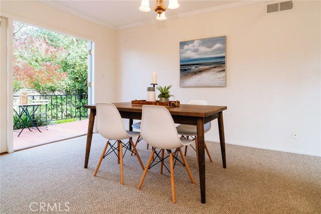 The family room and dining area looking out to the veranda and backyard.