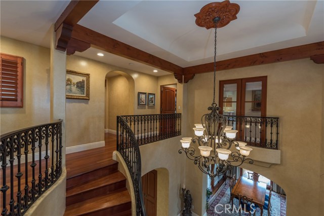 Looking toward the top of the stairway and landing.  Interior Juliet balcony beyond is adorable!