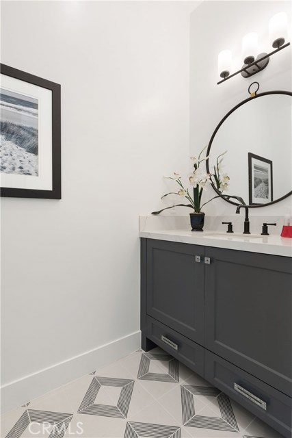 Powder Room - stylish tile and specialty hardware